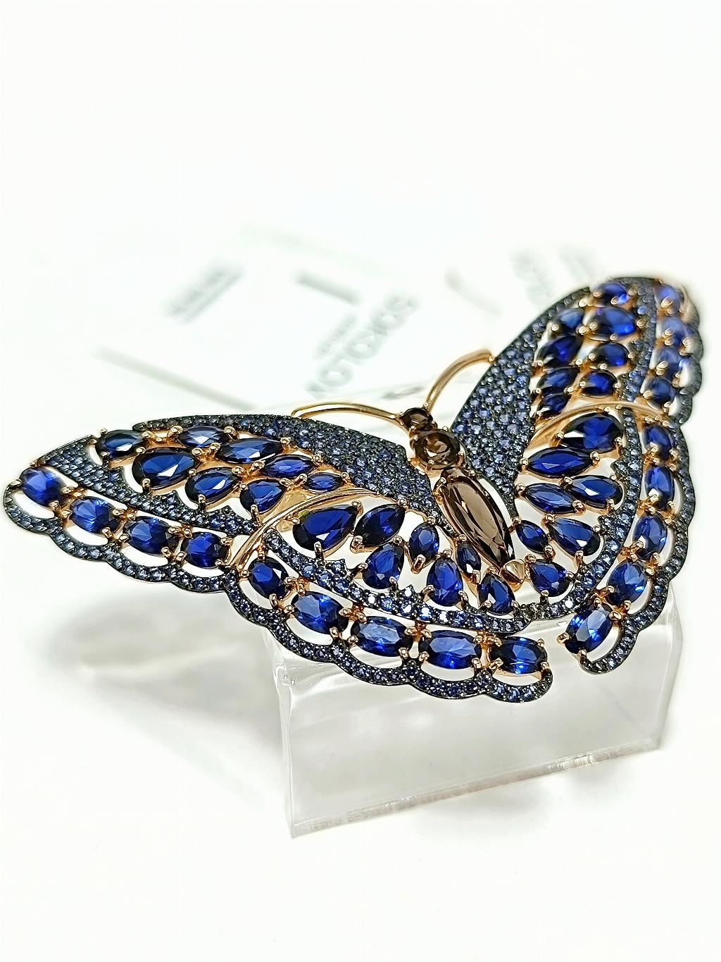 Золотая брошь женская, вставка сапфир